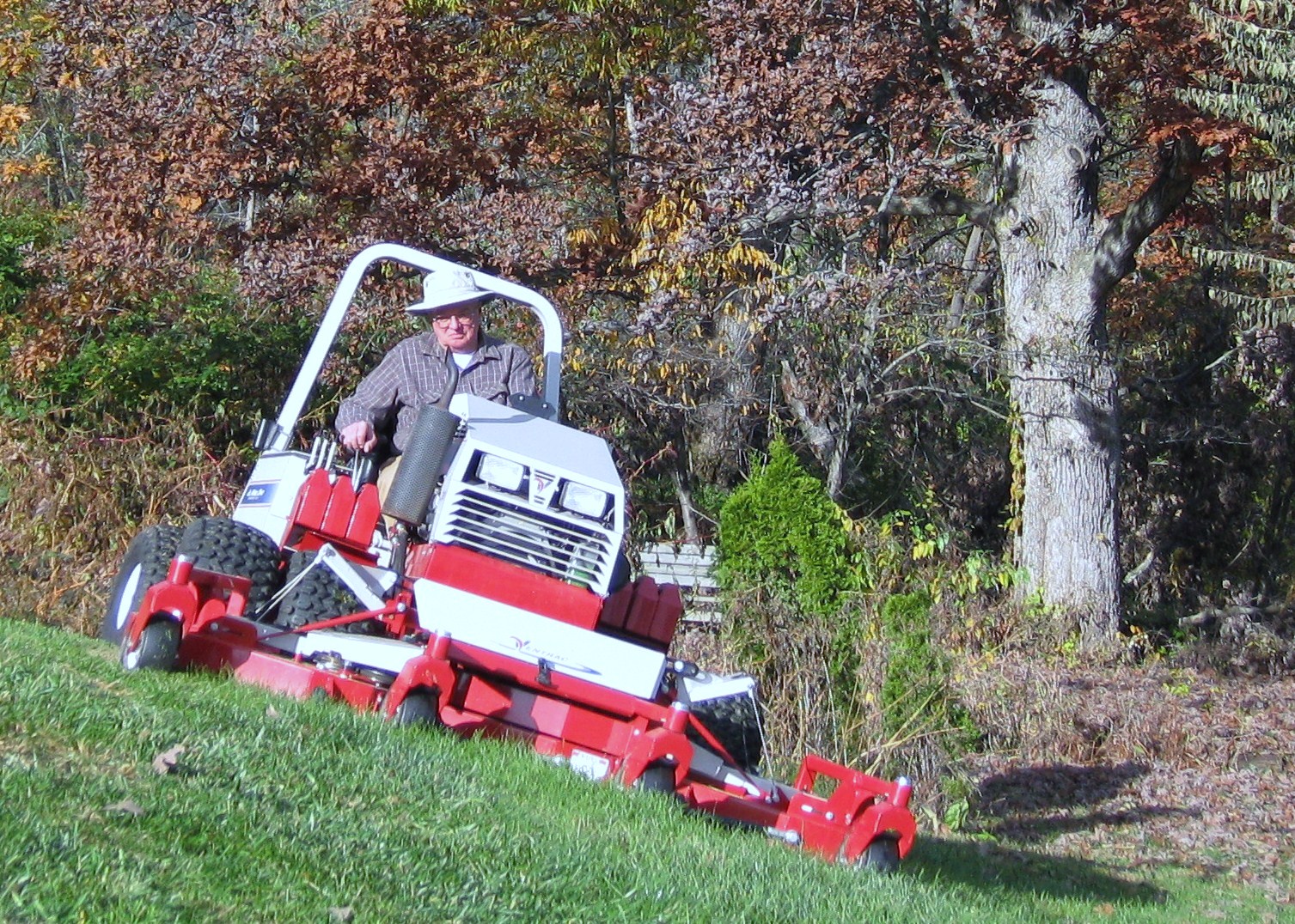 Ventrac contour mower mowing 28 degree slope